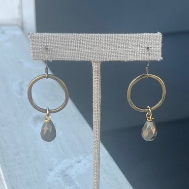These are beautiful earrings with a hammered circle base and dark gray teardrop bead! The bead is faceted and picks up the light as it turns - so pretty. These can be worn casual or dressy!  Designed and made by local artist