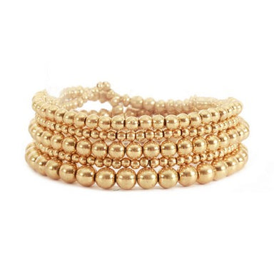 Adorn yourself with the timeless beauty of our Gold Beaded Bracelet Set! Featuring a set of 5 varying sizes of beads, this bracelet can be worn alone or all together for a stunning effect. Whether you're looking for something casual or dressy, this classic piece fits the bill!