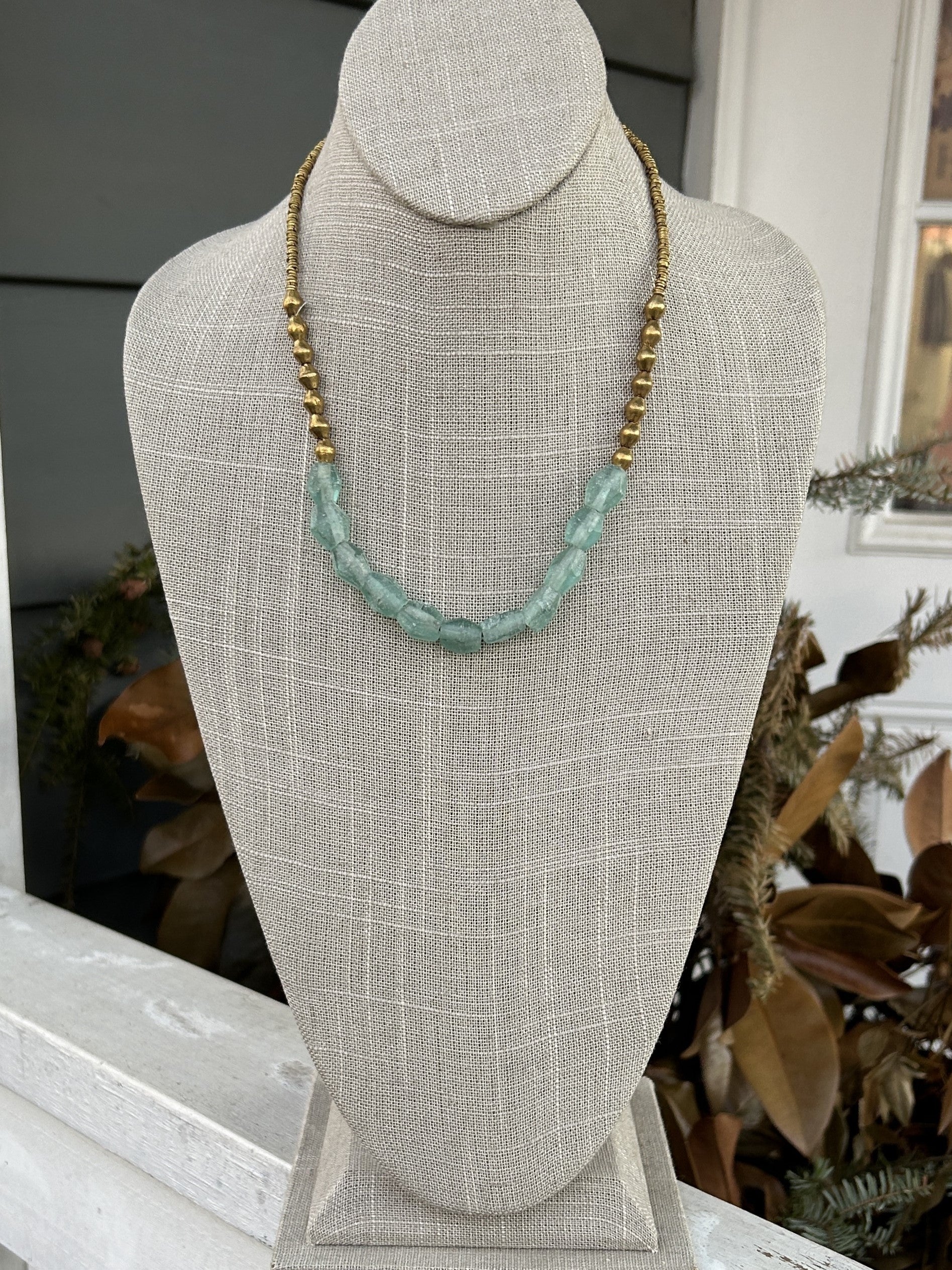 Transform any outfit with this Sea Glass Beaded Brass Necklace! The adjustable design allows for a perfect fit, while the brass beads and sea glass accent add a unique Boho look. Chic and versatile, this necklace is a must-have!