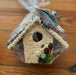 Absolutely the perfect gift for the bird lover or just the hard to shop for! These adorable seed covered bird houses will thrill your feathered friends, and the nature lovers your life.   Hand decorated with natural raffia, floral, cranberries, raisins, and millet.  Under the seed and decoration is a small ornamental wooden bird house.  Approximately 6″ tall.  Comes wrapped in cellophane with a to/from gift card. 