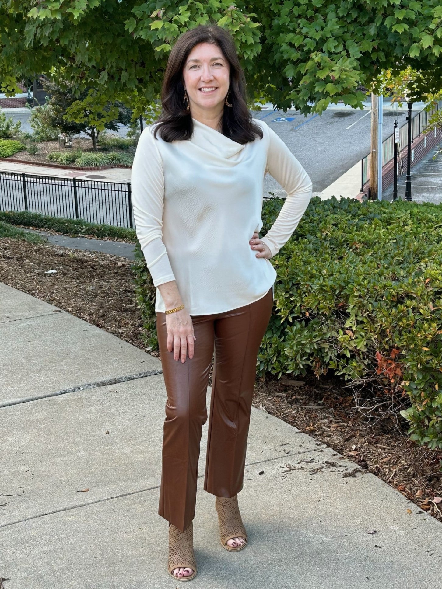 Look and feel confident in our Elysse Ankle Length Vegan Leather Pant. The beautiful whiskey brown color adds a touch of sophistication, while the hidden waist band and pull on style provide ease of wear. The front vertical stitching and raw hem add a touch of class to these versatile pants, perfect for both casual and dressy occasions.

Lyssé Fit 360° Smoothing
Lyssé concealed patented waistband
4-way stretch&nbsp;
Skims hips and thighs; flared leg
30" Inseam
Lightweight Vegan Leather- 100% Polyurethane