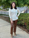 Look and feel confident in our Elysse Ankle Length Vegan Leather Pant. The beautiful whiskey brown color adds a touch of sophistication, while the hidden waist band and pull on style provide ease of wear. The front vertical stitching and raw hem add a touch of class to these versatile pants, perfect for both casual and dressy occasions.

Lyssé Fit 360° Smoothing
Lyssé concealed patented waistband
4-way stretch&nbsp;
Skims hips and thighs; flared leg
30" Inseam
Lightweight Vegan Leather- 100% Polyurethane