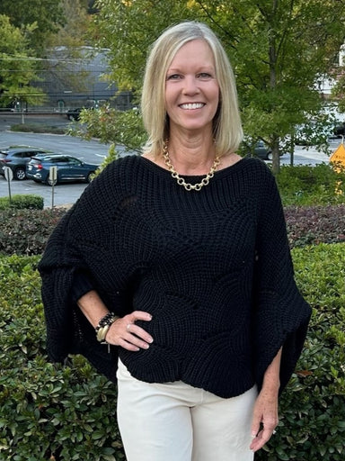 How cute is this crocheted cropped sweater?!&nbsp; With a bow neck, dolman sleeves and an open weave, and a scalloped hem, it is so simple but adorable! We are calling it cropped, but it hits at your hips. Layer it with your favorite tank, or in cooler weather with a turtleneck.&nbsp;

Available in 5 colors.&nbsp;

Material: 100% Acrylic

One size fits most.&nbsp;

Care Instructions: Hand wash cold, dry flat