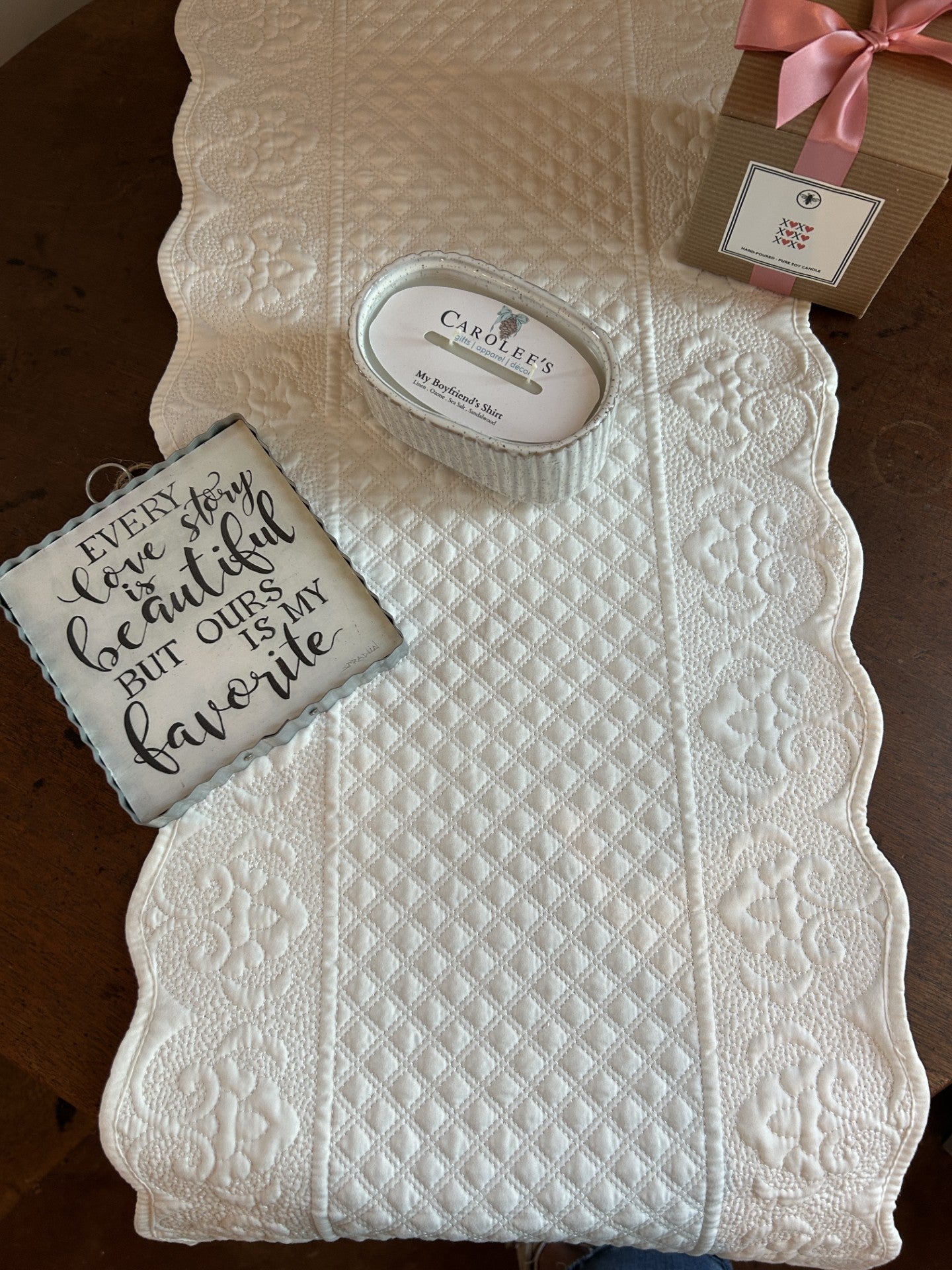 Transform your dining experience with this exquisite Solid White Quilted Table Runner, a versatile accent that complements any décor style. The luxurious quilted surface adds dimension and visual interest to your table, while gracefully scalloped edges provide a polished, sophisticated finish. Shimmered stitching details catch and reflect light, creating an understated glamour that elevates both everyday meals and special occasions. From formal dinner parties to casual family gatherings, this beautiful runn