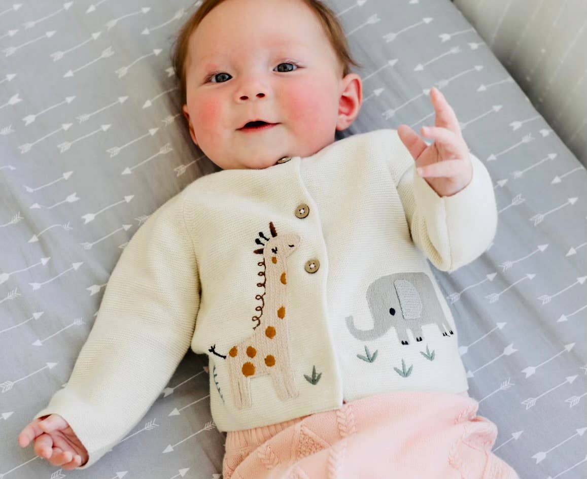 Experience the magic of our Animal Safari Embroidered Baby Cardigan Sweater! Made with 100% organic cotton, this natural colored long sleeve cardigan sweater is both soft and sustainable. The sweet and fun safari animal embroidery adds a playful touch, perfect for pairing with adorable leggings or a cute skirt. Versatile for all seasons, this cardigan is a must-have for your little one's wardrobe.  Eco-friendly, chemical free and non-toxic, good for baby's delicate skin.  Machine washable