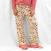 Pants  These are the cutest pajama pants! They are fun styles and the cutest coordinating ruffle hem. They are so soft and also have a coordinating tie at the waist.  Material: 95% Polyester / 5% Spandex  Care Instructions: Machine Wash Cold, Gentle Cycle, Tumble Dry on Low.  Tops  Solid tops to complete the outfit.  Too cute!  Material: Polyester & Spandex  Care Instructions: Machine Wash Gentle Cycle, Tumble Dry Low, Do Not Iron