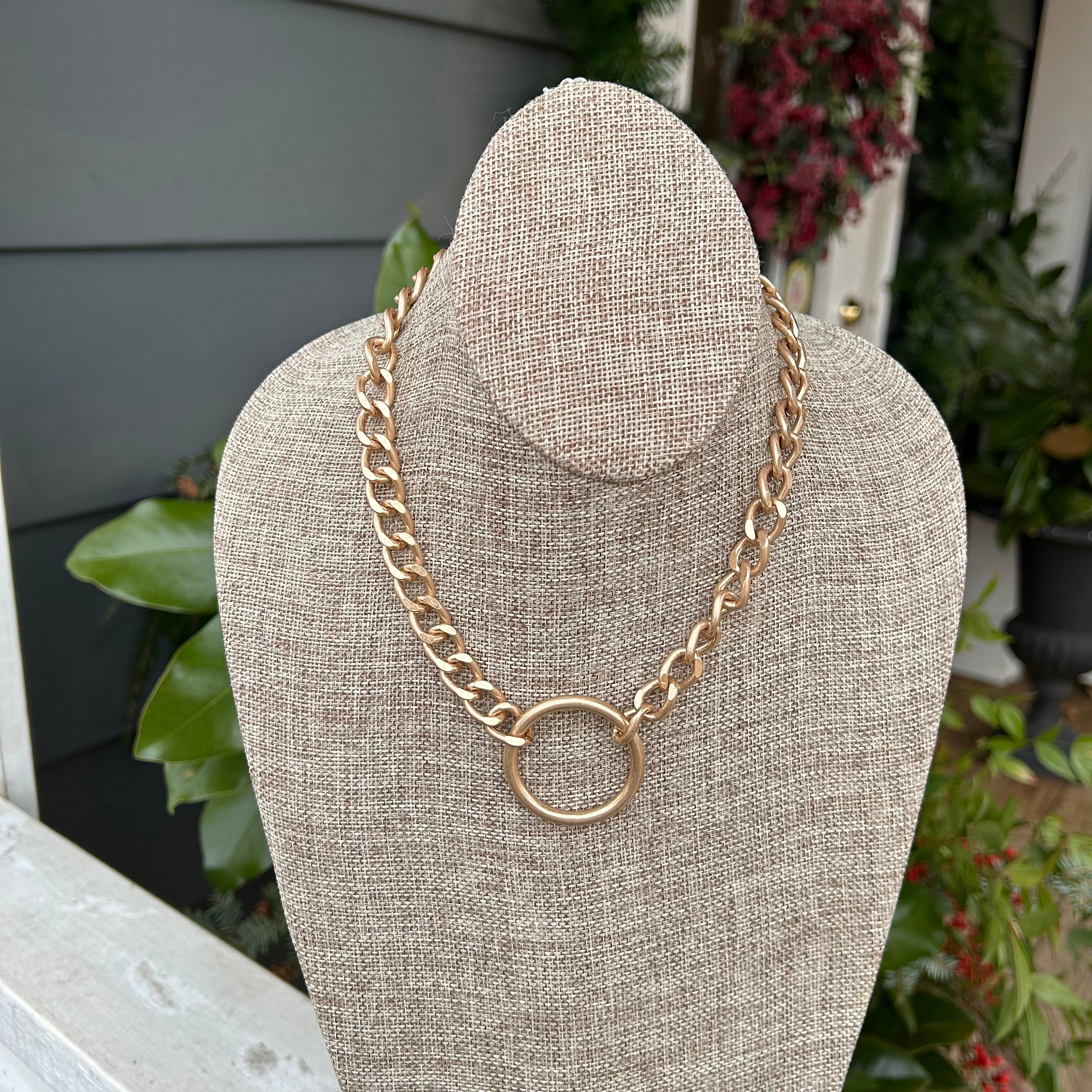 Add some edge to your style with this Chunky Chain Link Necklace featuring a stunning circle pendant – the perfect combination of bold and understated.   Approximate length: 16-19"