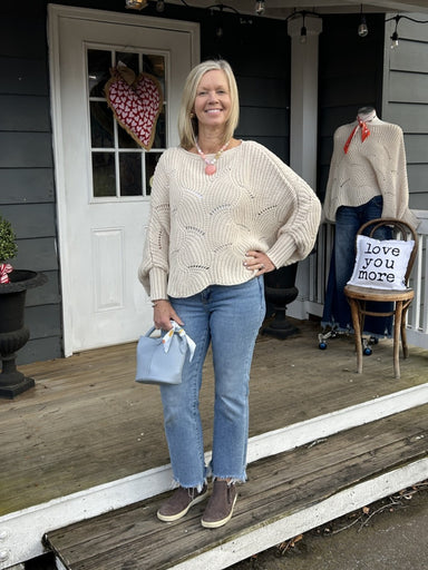How cute is this crocheted sweater?!&nbsp; With a boat neck, dolman sleeve, an open weave, and a scalloped hem, it is so simple but adorable! We are calling it cropped, but it hits at your hips. Layer it with your favorite tank, or in cooler weather with a turtleneck.&nbsp;

Available in 5 colors.&nbsp;

Material: 100% Acrylic

One size fits most.&nbsp;

Care Instructions: Hand wash cold, dry flat