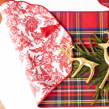 Transform your table into a festive focal point with this stunning reversible table runner. Featuring charming nutcracker toile prints on both sides, it effortlessly transitions from holiday celebrations to everyday elegance. The decorative tassels add a touch of sophistication and movement, while the reversible design gives you two distinct looks in one piece. Perfect for adding warmth and seasonal charm to any dining occasion, this versatile runner brings both style and practicality to your home.

Details