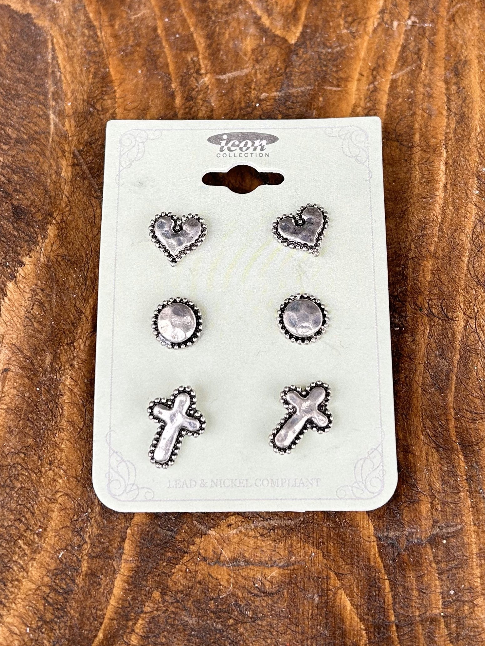 Discover the perfect gift with this Pewter Post Earring Set. Featuring a set of three post earrings in small yet delicate heart, circle and cross shapes, this set is perfect for adding subtle elegance to your look. 