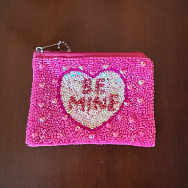 Made you smile! These bedazzled beaded change purses are just what that sassy gal in your world needs to take it up a notch!  Details:  5" x