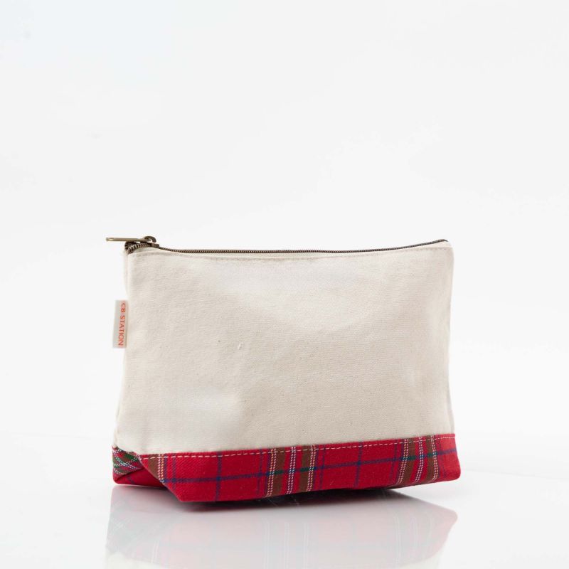 Organize your essentials in style with this Plaid Canvas Clutch featuring a classic red plaid pattern. Spacious enough to hold makeup, accessories, and everyday items, it's the perfect compact solution for keeping your larger bags neatly arranged while maintaining an elegant look.

For personalization, this bag can also be monogramed.&nbsp;

Details:

Size: 7" H X 11" W " 4" D
Material: 12 oz Canvas
Top zip closure