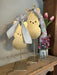 Bring springtime charm to your home with these delightful hanging metal bunnies. Crafted from durable metal with adorable ribbon accents, they're perfect for Easter displays or refreshing your spring décor. Lightweight and easy to hang, these bunnies add a festive touch to any room, porch, or garden space. Celebrate the season with timeless appeal that welcomes guests with warmth and personality.

Approximate Dimensions:

Small: 3 x 6
Medium: 4 x 8
Large: 5 x 10
