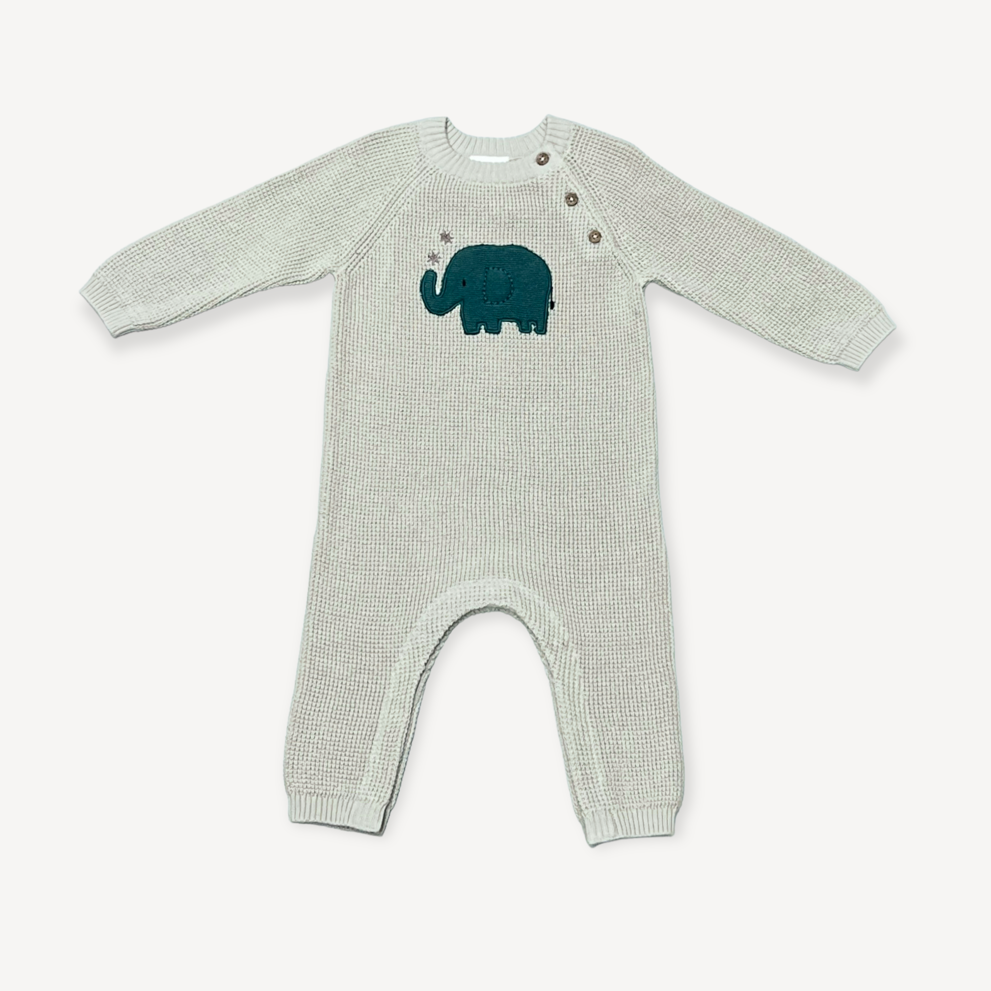 Wrap your little one in comfort and style with our Elephant Jacquard Knit Baby Jumpsuit. Made with breathable organic cotton, this chunky knit coverall romper keeps your baby cozy in any season. The fun elephant embroidery adds a playful touch, while the button closure makes dressing and changing a breeze.  Machine washable. Eco-friendly, chemical free, non-toxic, pure, natural & organic. Ethically produced in India, supporting better livelihoods for small grower farmers. 