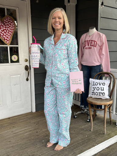 Slip into comfort with our Mahjong Stripe PJ Set, crafted from soft woven cotton for nights of blissful rest and mornings of effortless ease. This charming ensemble features a classic button-down long sleeve top paired with drawstring waist pants, both designed with an adjustable fit that moves with you. The whimsical mahjong-inspired toile print adds a playful touch to your sleepwear rotation. Whether you're unwinding after a long day or lounging on lazy weekends, this versatile set delivers the perfect bl