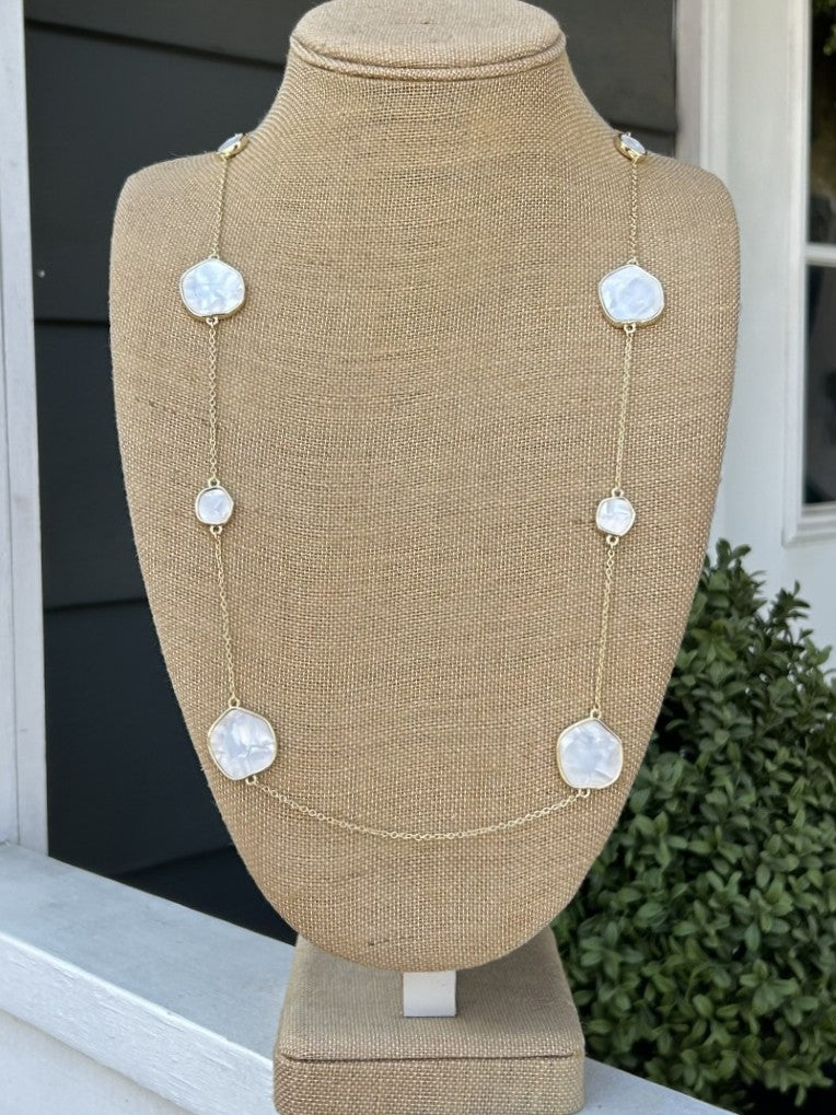 This elegant long necklace combines iridescent mother of pearl accents with a delicate gold chain for understated luxury. The extended length allows for layering or solo wear, making it a versatile addition to your jewelry collection. Perfect for adding a touch of sophistication to casual or formal occasions.

Approximate Length: 34-36"

Note: Silver N' Accessories jewelry is brass and stainless steel with rhodium and 18 KT gold plated. It's water resistant and anti tarnish, but it's recommended not to wear
