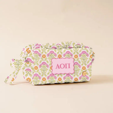 Organize your daily essentials in style with this Sorority Quilted Cosmetic Pouch. Featuring soft quilted fabric and a Greek letter patch, it's designed for sorority sisters who value both function and flair. The water-resistant lining protects your makeup and accessories, while the gold zipper hardware adds a touch of elegance. Compact enough to slip into any bag, this pouch is your go-to companion for dorm life, travel, or everyday carry.

Details:

Perfect size for your daily must-haves
Soft quilted fabr