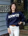 Wrap yourself in warmth and style with our "AM🖤UR" Long Sleeve Sweater Top. Featuring adorable lettering in white on a navy background, a crew neck, banded cuff and waist, this sweater is the perfect addition to your wardrobe. Stay cute and cozy in this must-have piece!

Material: 100% Acrylic

Care Instructions: Hand wash cold, line dry