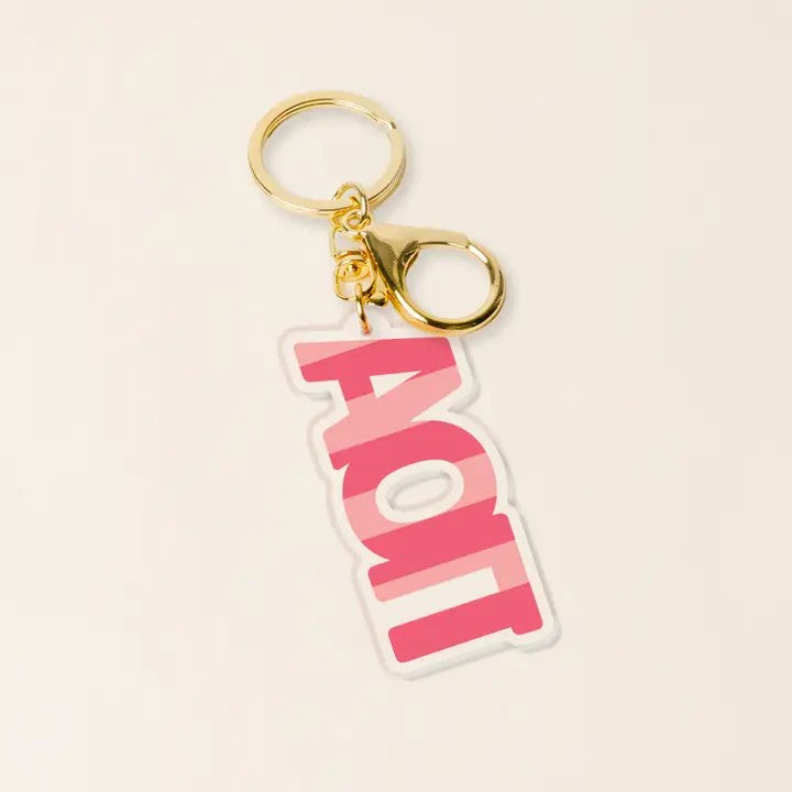 Display your sorority affiliation with pride using this vibrant Acrylic Keychain, featuring bold striped design and elegant gold-tone hardware. The durable acrylic construction combined with a sturdy keyring makes it perfect for everyday use or as a meaningful gift for pledge class celebrations, big/little events, or sisterhood milestones. Lightweight and eye-catching, it's an ideal way to personalize your keys while celebrating your Greek life.

Details:

Durable acrylic keychain designed for everyday use
