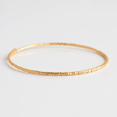 Accessorize your look with Norah Bangle Bracelets! These delicate pieces feature an adjustable bangle bracelet and colored beads accented with gold. Whether you wear them alone or stack them together, their beauty will always stand out. Highlight your natural splendor with Norah Bangle Bracelets!