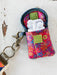 Protect your earbuds in style with this vibrant, puffy case featuring eye-catching mixed prints. The convenient Velcro flap closure keeps your earbuds secure and tangle-free, while the attached keychain loop makes it easy to carry wherever you go. Say goodbye to lost or damaged earbuds—this adorable case has you covered.

Dimensions:&nbsp;3.75in L x 3.25in W

Material &amp; Care:

100% polyester
Spot Clean Only With A Damp Cloth