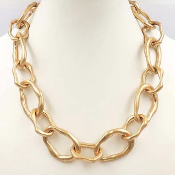 Make a bold statement with this stunning chunky gold necklace, featuring oversized hammered links that catch the light beautifully. The substantial chain design delivers serious impact, perfect for layering or wearing solo as your go-to statement piece. Crafted with an eye-catching textured finish, this necklace elevates any outfit from casual to sophisticated in seconds.&nbsp;

Length: 18"