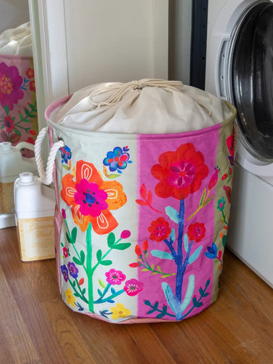 <p>Transform laundry day into a breeze with this Collapsible Floral Laundry Hamper! Its convenient drawstring top, sturdy rope handles, and heavy-duty canvas make it perfect for dorms, apartments, and RVs. But it doesn't just stop at laundry, this cute hamper is also great for storage.&nbsp;<span data-mce-fragment="1"></span></p> <p>Details:</p> <ul> <li>Fully Collapsible. Features sturdy braided rope handles and drawstring opening</li> <li>55% cotton, 45% polyester