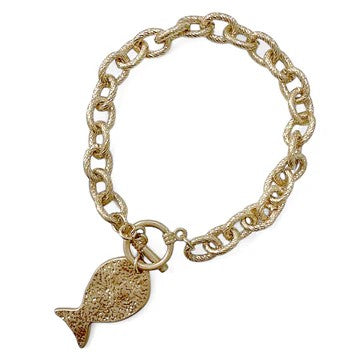 This textured chain bracelet brings effortless charm to your wrist with its whimsical hammered fish pendant. Designed for those who love a touch of personality in their accessories, it pairs casual sophistication with playful flair. The dependable T-bar closure keeps everything secure, so you can wear it confidently from morning to night. A delightful piece that celebrates your unique style and adds just the right amount of fun to any outfit.