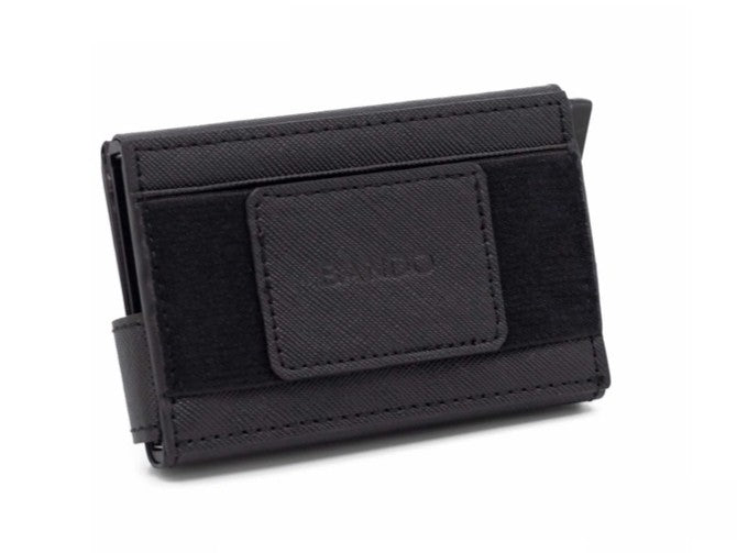 Slim Utility Wallet combines form and function with a durable, weatherproof canvas construction that withstands daily use. The magnetic security latch and silicone-grip cash band keep your essentials secure, while the quickdraw ejection port gives you instant access to your 5 most-used cards. Store up to 8 cards plus bills across 2 front slots and 1 hidden back slot—all without the bulk. Minimal design, maximum utility.

Material: Weatherproof Saffiano canvas

Approximate dimensions: 4.25 x 2.5 x 0.8