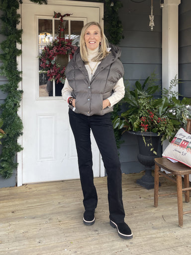 Stay cozy in style with this Batwing Puffer Vest. This vest features a hood, snap closure, front pockets, and a cropped length. Whether you’re headed to a casual weekend outing, or just lounging at home, this vest will keep you warm and comfortable without compromising on style.  One Size Fits Most  Material: 100% Nylon  Care Instructions: Hand wash cold, hang/flat dry