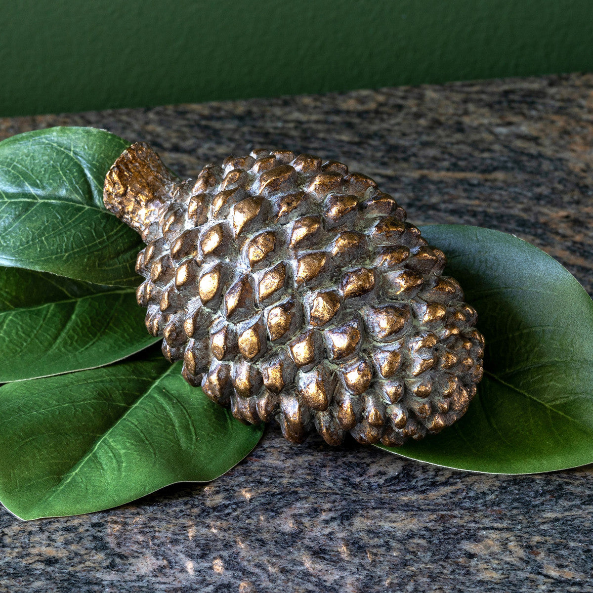 Our Bronze Pinecone is an ornate and sturdy statement piece that will add a touch of elegance to any room. Crafted from heavy duty bronze, these beautiful decorative pinecones will look stunning on a tabletop or shelf. A timeless classic, this item will never go out of style.