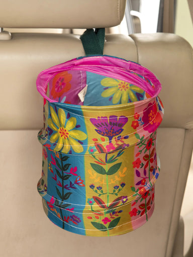 <p>Make your car or dorm room clutter-free with our Pop-Up Car Trash Can! Easy to use and store, it securely attaches to your car's headrest with a built-in loop. Say goodbye to messy spaces with this convenient and efficient solution! Keep your space clean and organized with ease!</p> <p>Nylon straps have snaps for easy attaching and storage. Great for cars, camping and small spaces</p> <p>Material: 100% polyester, exclusive of trim</p> <p>Care Instructions: Wipe Clean With Damp Cloth</p>