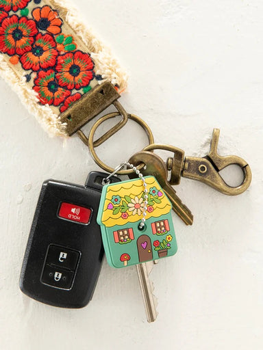 Transform your everyday keys into something special with this adorable House Key Cap. Designed with charm and practicality in mind, it features a sturdy grip that keeps your key secure while adding personality to your keychain. Each cap comes with a fun sentiment printed on the back—a delightful surprise every time you reach for your keys. The included ball chain makes attachment effortless, so you can clip it to your bag, purse, or keyring instantly. Perfect for adding a touch of joy to your daily routine 