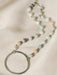 This stunning Selena necklace features a hammered silver metal circle pendant, accented by round Amazonite beads. The combination of brass and bead chain adds a touch of elegance to this piece.

16" long with 2" extender

Care Instructions: Avoid water, soap, and harsh chemicals. Store in a box or bag in a cool, dry place. Clean using a dry soft cloth.