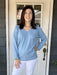Transition effortlessly between seasons with our Camelia V-Neck Sweater! The lightweight design and stunning sky blue color make it perfect for spring, summer, and fall. Plus, the V-neck and banded cuffs and waist add a stylish touch to the classic raglan sleeve.&nbsp;  One size fits most.  Material: 52% Viscose / 24% Polyamide / 20% Polyester / 4% Elastan