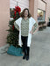Stay cozy and chic with the Cora Duster - the perfect transitional layering piece! The one-size-fits-all wrap features a unique silhouette that can be worn over any shirt, blouse, or sweater. Enjoy warmth and style in one stunningly versatile package.  Classic fit—one size fits most. Open wrap. Italian knit blend. Hand wash, lay flat to dry. Made in Italy.