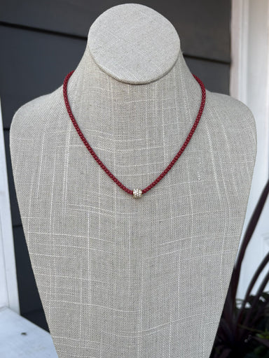 Cheer in confidence with the Cassie Game Day Necklace. This short, striking piece features a rhinestone tube charm. Perfect for game day enthusiasts, it pairs effortlessly with team colors and casual wear alike. Lightweight, eye-catching, and designed to be your go-to accessory for every victory lap.