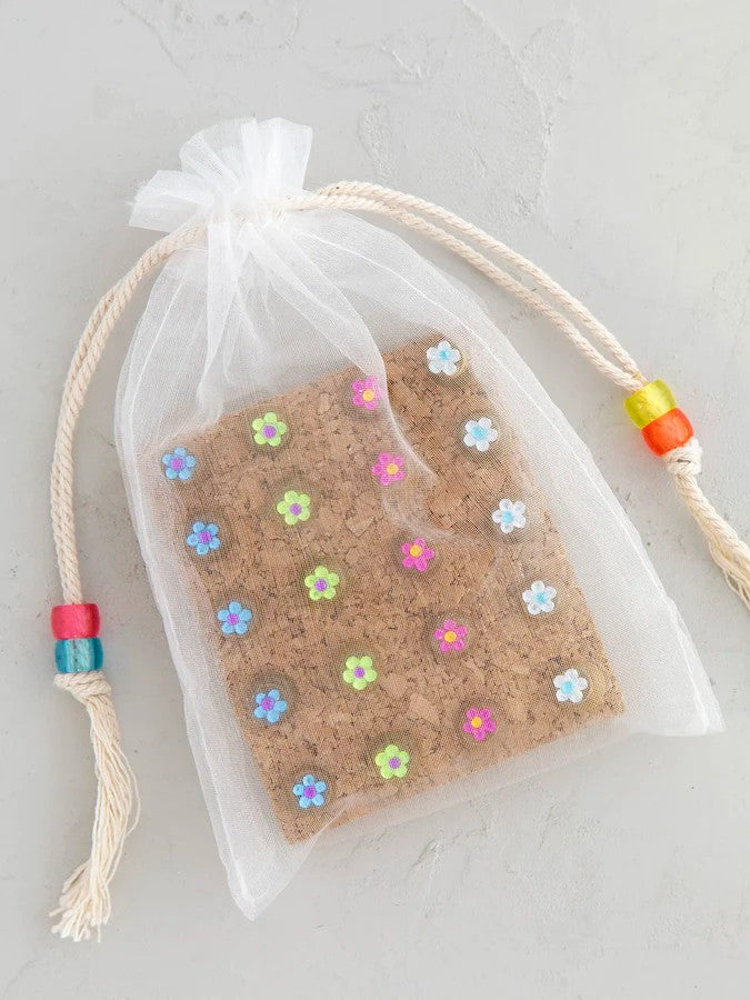 Add a touch of elegance to your workspace with these 20 rhinestone flower push pins. Each pin showcases a stunning rhinestone-adorned flower that instantly upgrades any bulletin board or inspiration wall. Presented on natural cork backing and nestled in a delicate organza bag, this set makes a thoughtful gift for anyone seeking functional beauty. Ideal for personalizing dorms, home offices, or creative spaces with a sophisticated flair.

Details:

Set of 20 rhinestone flower decorative push pins
Displayed o