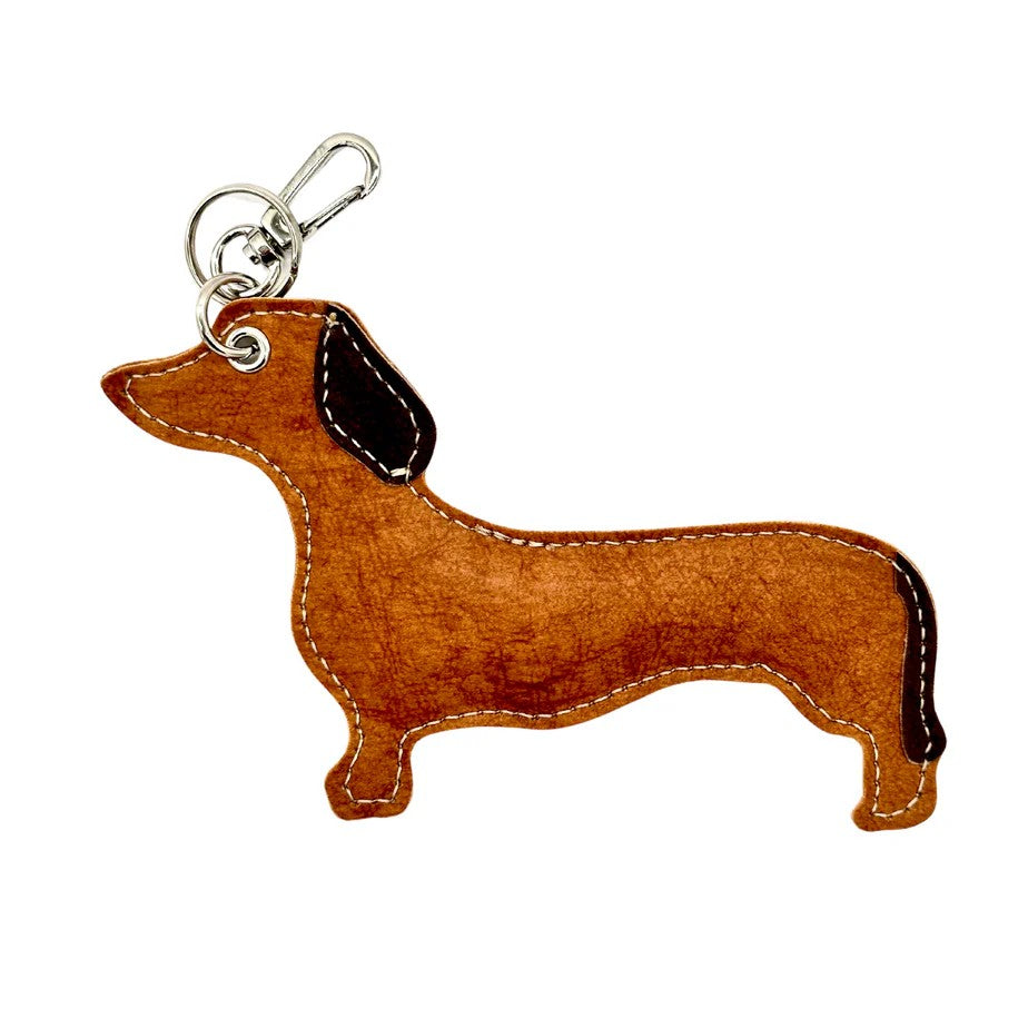 Adorable dog-themed key rings and bag charms that bring playful personality to your everyday essentials. Each piece captures whimsical charm and Italian-inspired design, perfect for securing your keys or adding a delightful accent to your bag. Mix and match these cheerful companions to express your unique style.

Material: AGGO® Washable Paper

Made in Italy