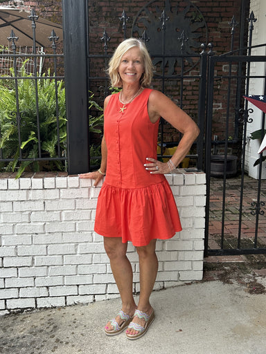 You will love our vibrant orange sleeveless dress featuring a charming drop tier skirt and faux button front detail. Lined for comfort with a back zipper for easy wear. Versatile enough for game day casual paired with sneakers, or elevated with sandals and accessories for a polished look. Perfect for spring and summer occasions. Pair with a skinny scarf or denim jacket for cool evenings.


Barbara is wearing a Small.

Material: 95% Cotton / 5% Spandex; Lining: 100% Polyester

Care Instructions: Gentle cool 