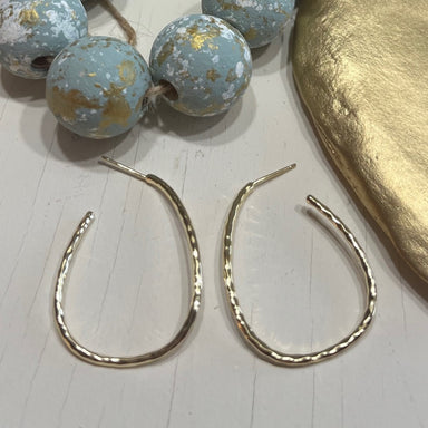 Upgrade your earring game with our Estevan Hoop Earrings! These post earrings feature delicate hoops with a shiny hammered look that can easily transition from casual to dressy. A must-have for your collection.