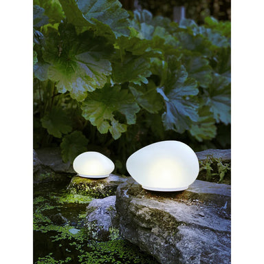 Illuminate your outdoor spaces with the Solar Glass Pebble—a stunning blend of form and function. These solar-powered lights capture daylight energy and release a gentle, warm white glow after sunset, transforming gardens, pathways, and patios into magical nighttime retreats. Crafted from premium glass and engineered for durability, they withstand rain, frost, and UV exposure while requiring zero electricity or maintenance. Create an inviting, eco-conscious atmosphere that's as beautiful as it is sustainabl