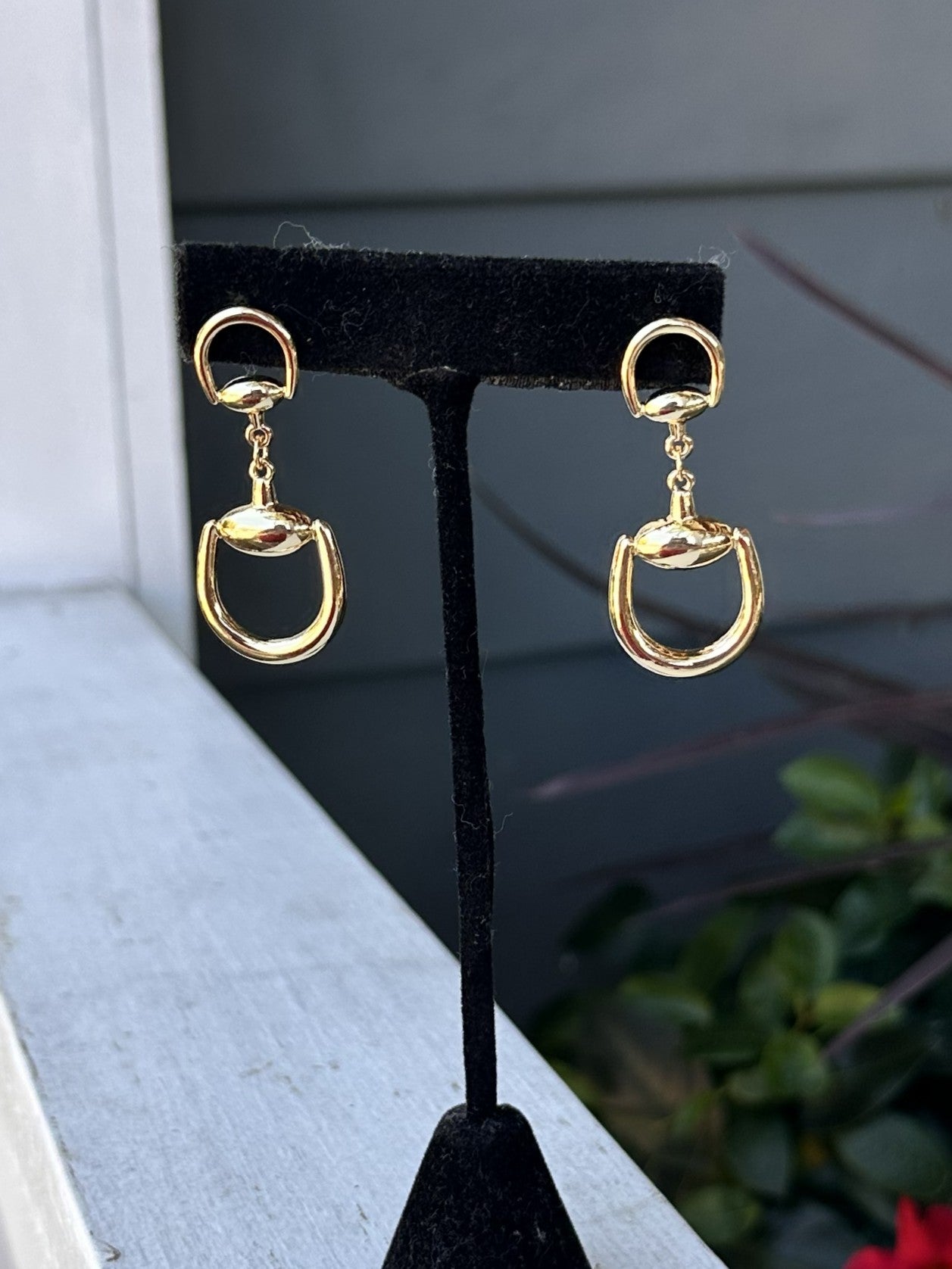 These timeless snaffle bit post earrings bring equestrian elegance to your jewelry collection. Rendered in lustrous gold and/or silver, each earring features the recognizable horse bit motif in a graceful drop style. The post setting provides secure, comfortable wear throughout the day. A sophisticated choice for horse lovers and anyone who appreciates classic, refined accessories with character.