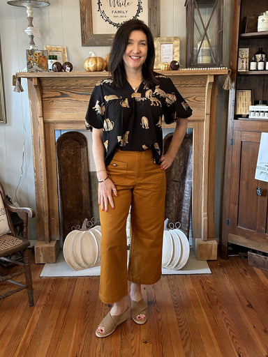 Feel your most confident with these high waist button front pocket pants. The beautiful camel color and gold accent buttons make them perfect for fall. The high waist and wide leg fit provide a flattering silhouette. Look amazing!  Material: 100% Cotton  Care Instructions: Hand wash cold, flat dry 