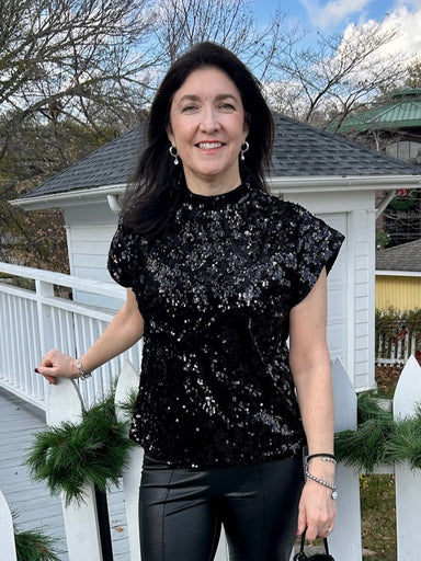 Discover understated luxury with this captivating short sleeve sequined top. Adorned with shimmering black sequins that catch light beautifully, it's the ideal choice for anyone seeking elegance at seasonal celebrations and special events. The refined design flatters effortlessly while delivering that coveted glamorous touch your wardrobe needs.

Material: 95% Polyester / 5% Spandex

Care Instructions: Gentle cool hand wash, dry flat