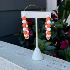 Show off your team spirit with our Game Day Hoop Earrings! Perfect for any collegiate event, these fun earrings are a must-have for any fan. Let these earrings be a representation of your love and support for your team. Join in on the fun and show your true colors with our Game Day Hoop Earrings!