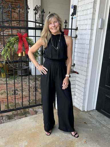 This elegant halter mock-neck jumpsuit is the ultimate closet investment—a single piece that delivers maximum versatility. The striking halter neckline offers a polished, sophisticated look that flatters effortlessly, while the streamlined cut works beautifully worn alone or layered under your favorite denim jacket. Dress it down with sandals for relaxed weekend style, or elevate it with boots for a more refined appearance. This jumpsuit transitions seamlessly across occasions, making it the go-to piece you