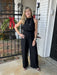 This elegant halter mock-neck jumpsuit is the ultimate closet investment—a single piece that delivers maximum versatility. The striking halter neckline offers a polished, sophisticated look that flatters effortlessly, while the streamlined cut works beautifully worn alone or layered under your favorite denim jacket. Dress it down with sandals for relaxed weekend style, or elevate it with boots for a more refined appearance. This jumpsuit transitions seamlessly across occasions, making it the go-to piece you