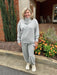 These Heather Gray Jogger Pants combine softness and coziness with practical design. Featuring an elastic waist and cuffs for a comfortable fit and convenient side pockets, they are perfect for everyday wear. A versatile staple, these joggers effortlessly blend comfort and style to keep you feeling great all day long.

Paula is wearing a size Medium.

Pair with our matching "Cowl Neck Sweatshirt".

Material: 48% Modal / 48% Polyester / 4% Spandex

Care Instructions: Hand wash separately in cold water, hang 