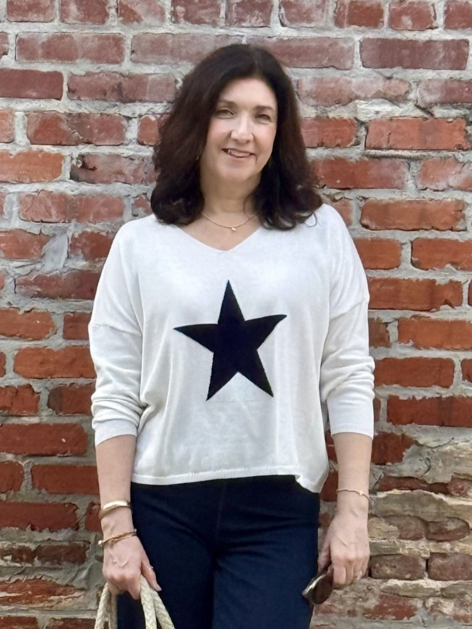Introducing the Sharon Lightweight Star Sweater, the perfect lightweight sweater! The beautiful cream color and lightweight material make it a great transition piece for any season. With long sleeves, this sweater offers both style and comfort.

Tara is wearing size medium.
